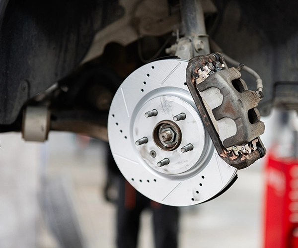 Close up of a brake disc and caliper on a car