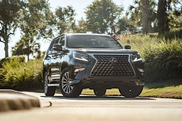 black Lexus SUV parked in a driveway